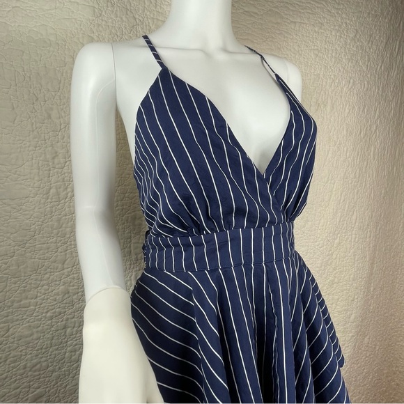 🔥Lulus Ruffle & Flow Black Striped Backless Ruffle
Romper Blue White - Picture 5 of 16